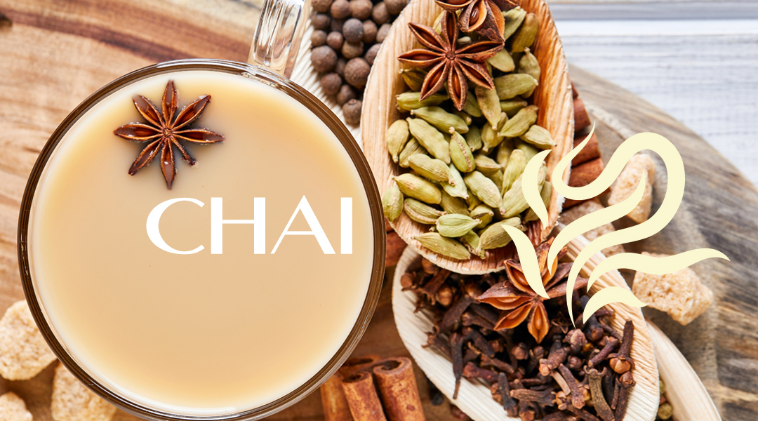 Traditional Indian drink - masala tea with spices. Cinnamon, cardamom, anise, sugar, cloves, pepper on a light wooden background.